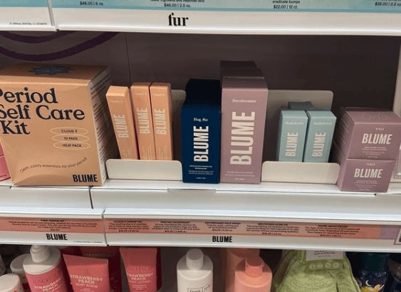 Close up of a shelf at a retail location with bloom products along it.