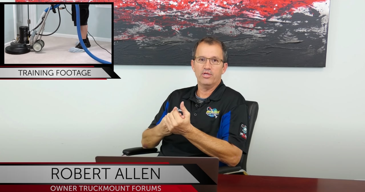 Screenshot of TruckMount Forums Youtube Video with Robert Allen sitting at a table 